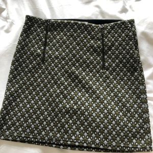 Urban outfitters mini stretch skirt with zips. Tags on never worn. Size M.